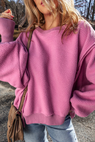 Loose Fitting Orchid Pink Sherpa Pullover with Side Slits and Exposed Seam Details