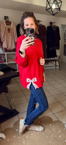 Red Pullover with Floral Bow Patchwork and Exposed Seams