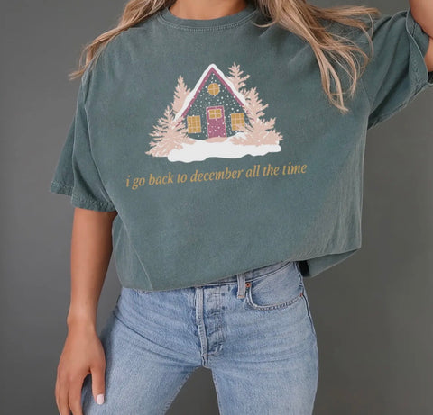 'i go back to december all the time' Graphic Tee with Winter House - Tay Christmas - Pink Christmas - Green Comfort Colors Tee
