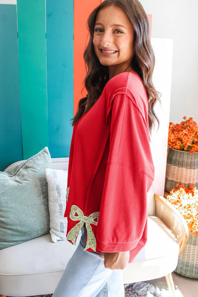 Red Pullover with Floral Bow Patchwork and Exposed Seams